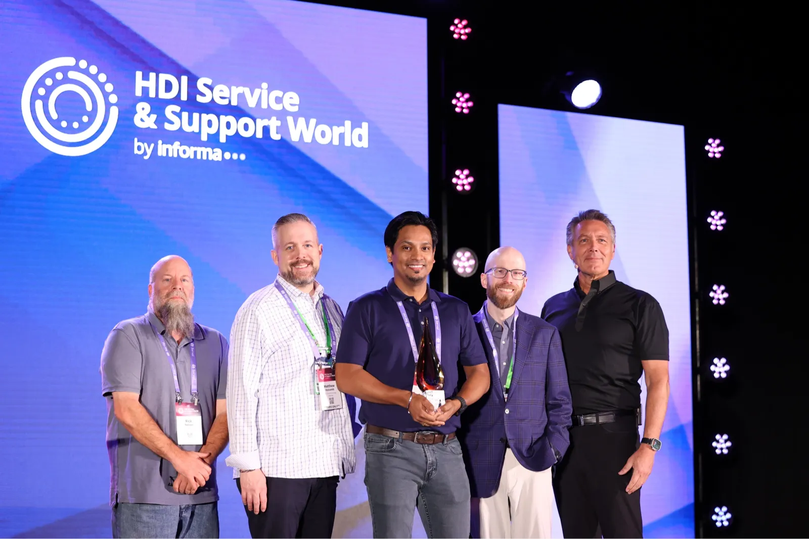 Jisu Dasgupta with HDI award recipients and presenters on stage